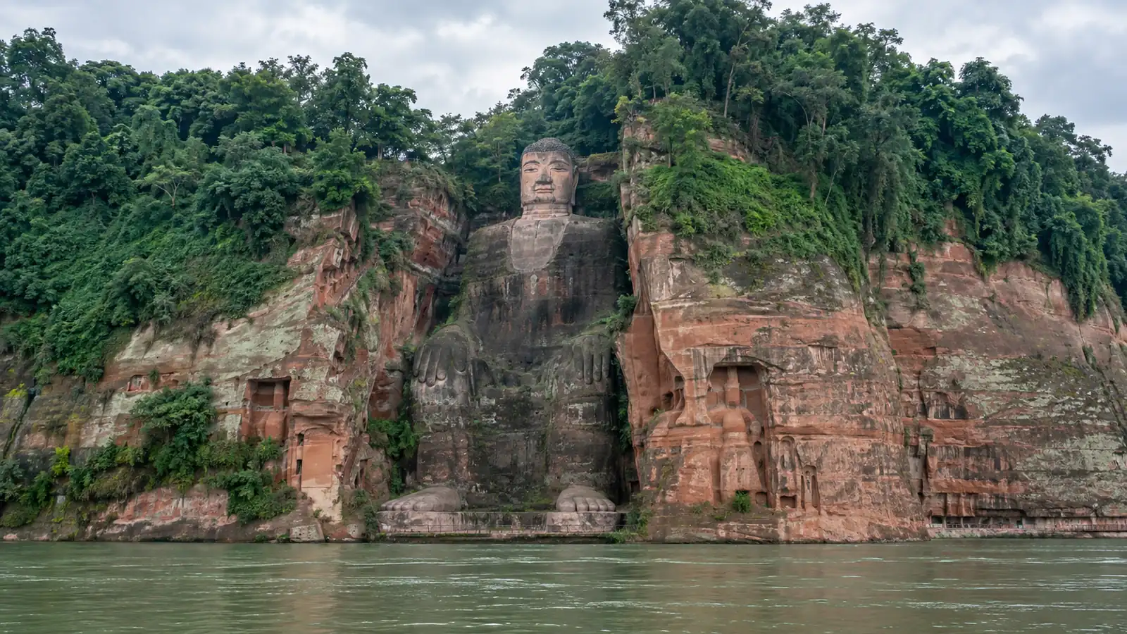 Leshan Giant Buddha from the river Leshan Giant Buddha carved into the riverside cliff