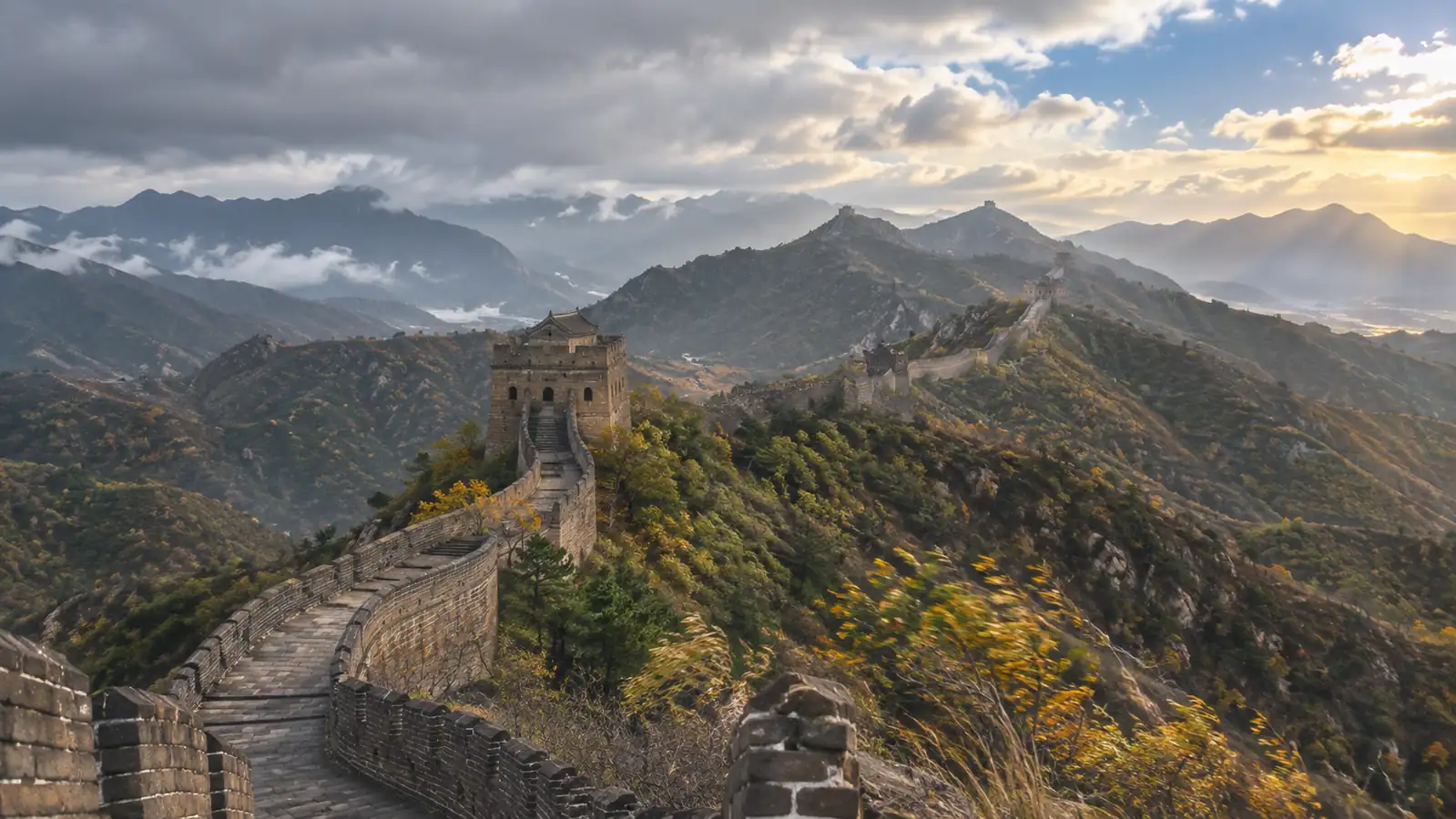 Great Wall across exposed Beijing mountain ridges under changing weather Great Wall across exposed Beijing mountain ridges under changing weather
