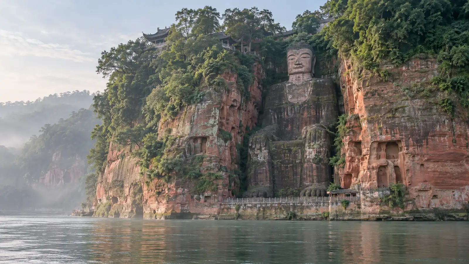 Leshan Giant Buddha day trip from Chengdu Leshan Giant Buddha carved into a red sandstone cliff above the river