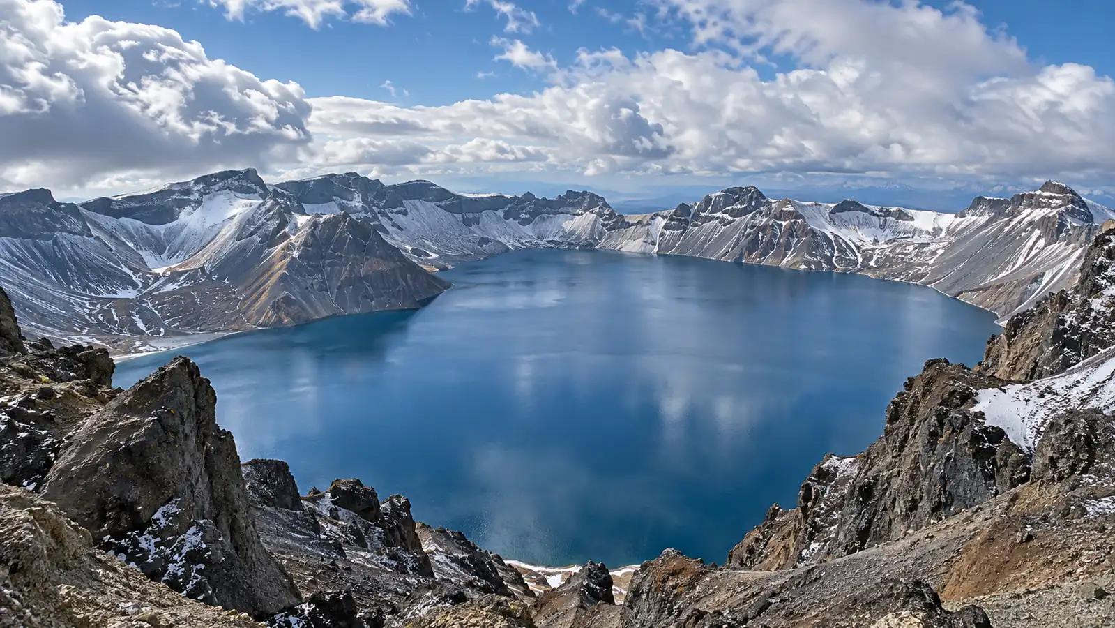 Changbai Mountain volcanic crater lake and snowy caldera Changbai Mountain volcanic crater lake and snowy caldera