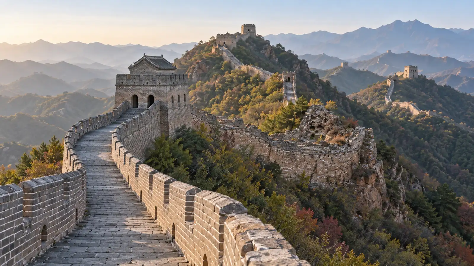 Restored and weathered Great Wall masonry meeting along a Jinshanling ridge