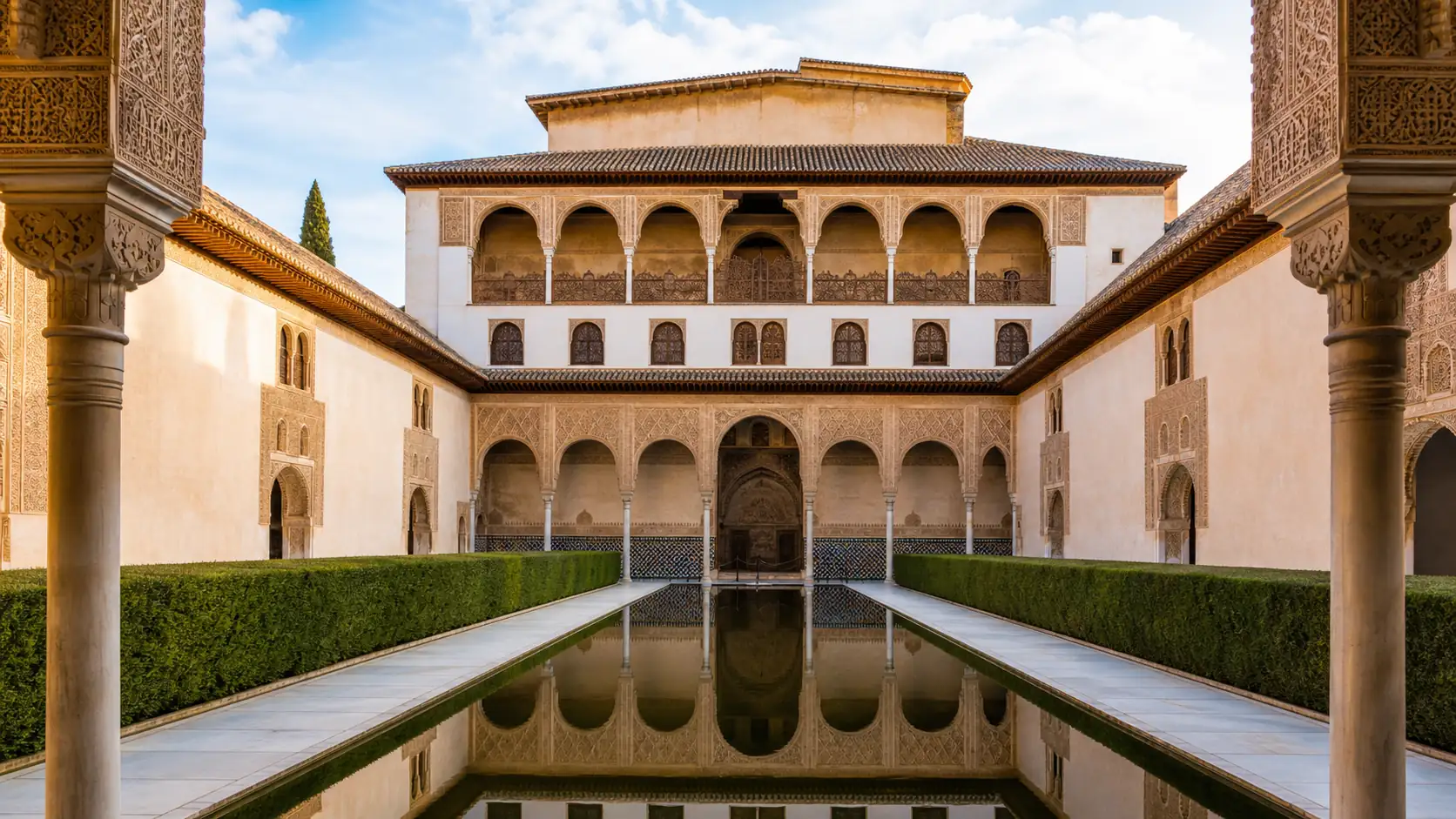 Alhambra Nasrid Palaces courtyard and Moorish arches in Granada Alhambra Nasrid Palaces courtyard and Moorish arches in Granada