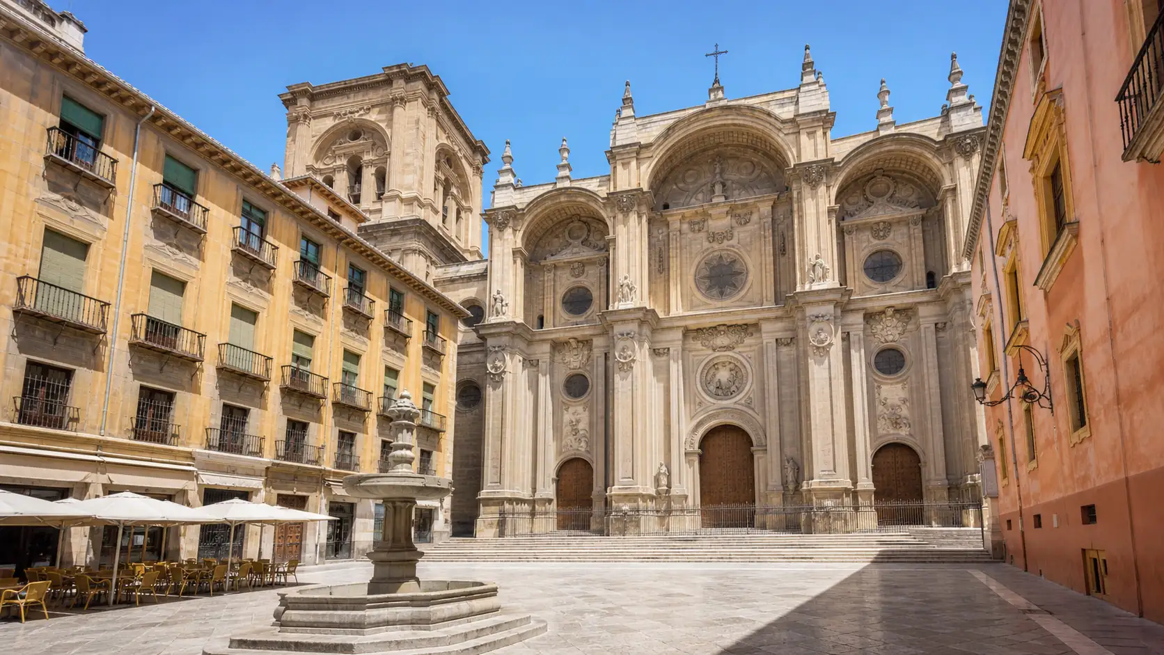 Granada Cathedral and historic center in bright daylight Granada Cathedral and historic center in bright daylight