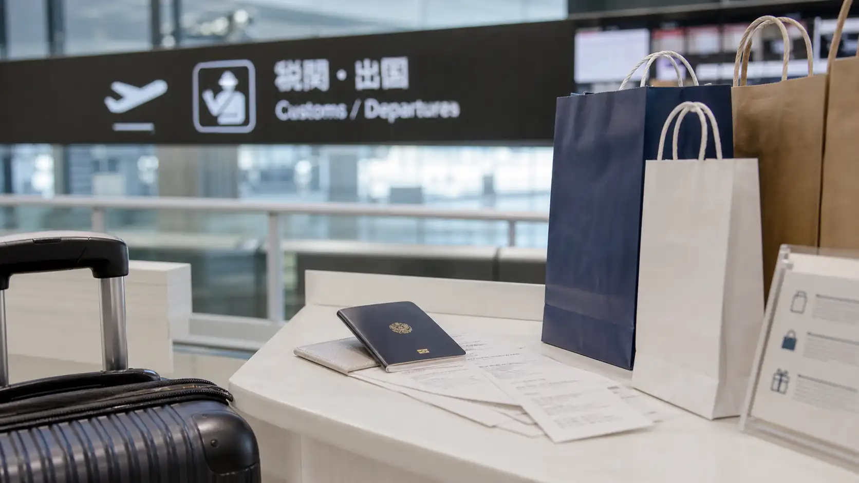 Japan departure preparation with tax receipts Japan airport departure preparation with receipts passport and luggage