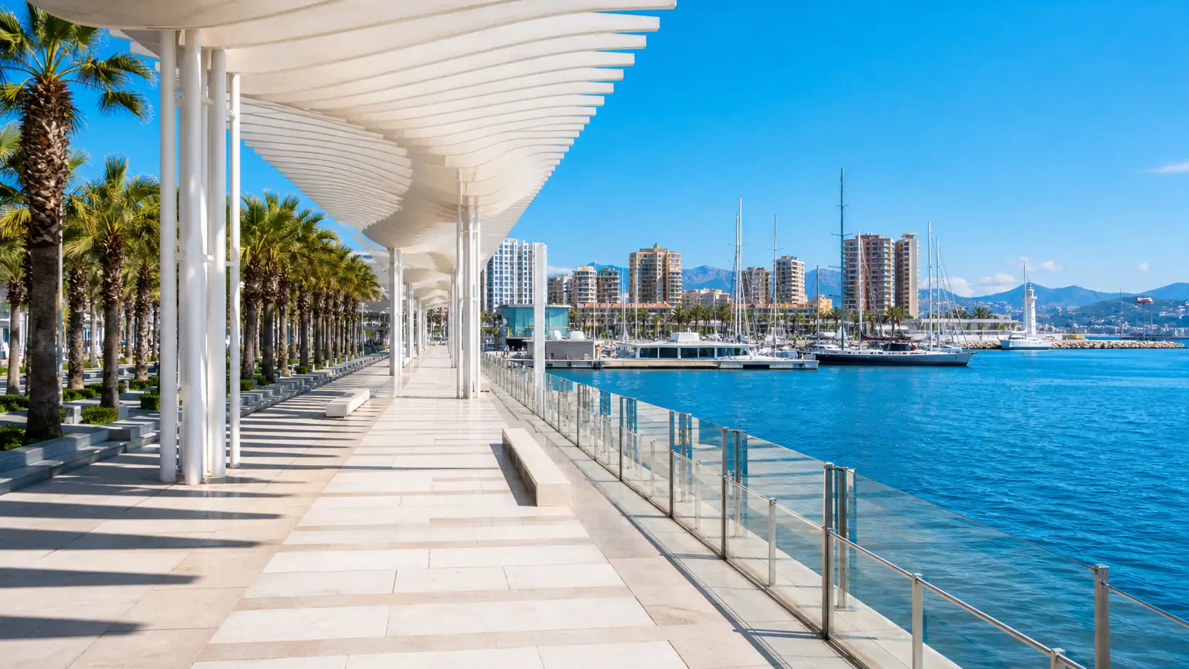 Malaga port promenade and marina in bright coastal light Hafenpromenade und Jachthafen von Malaga im hellen Küstenlicht