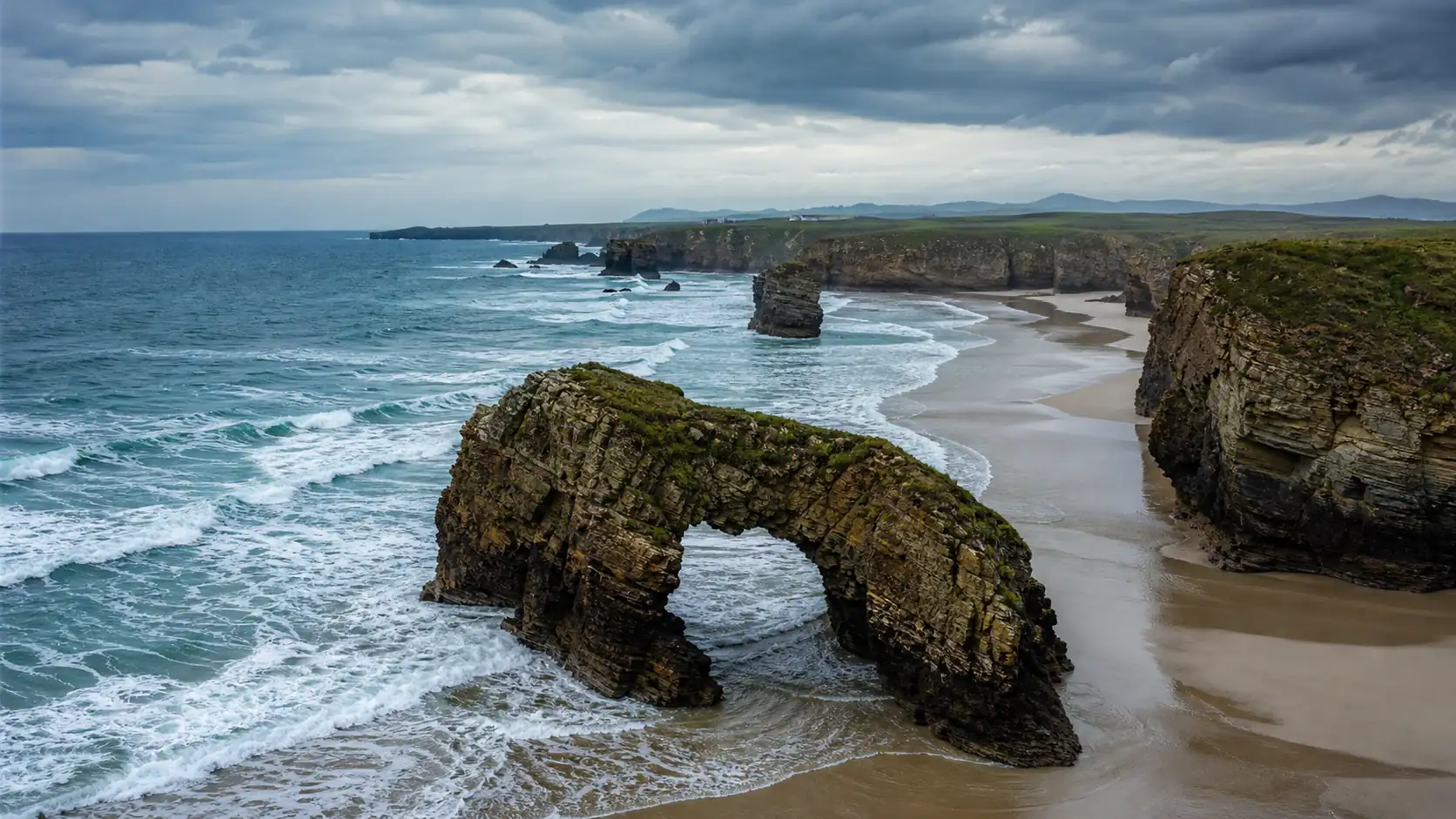 Rock arches and green cliffs on Spain's northern Atlantic coast Rock arches and green cliffs on Spain's northern Atlantic coast