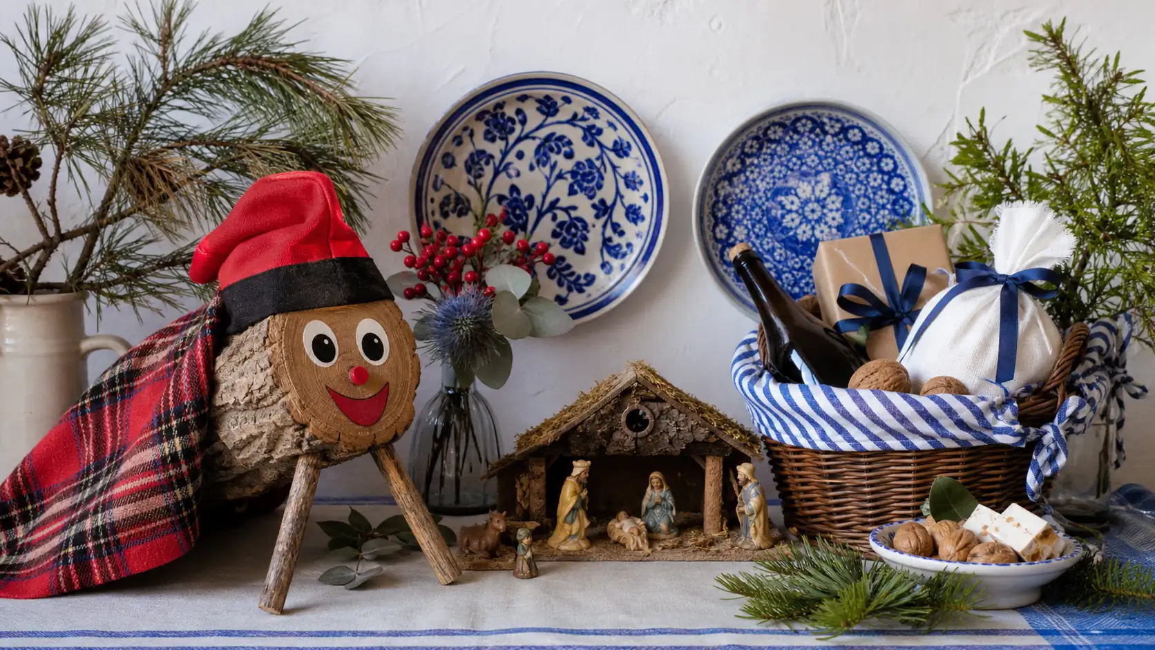 Regional Spanish Christmas customs with caga tio nativity scene and gift basket