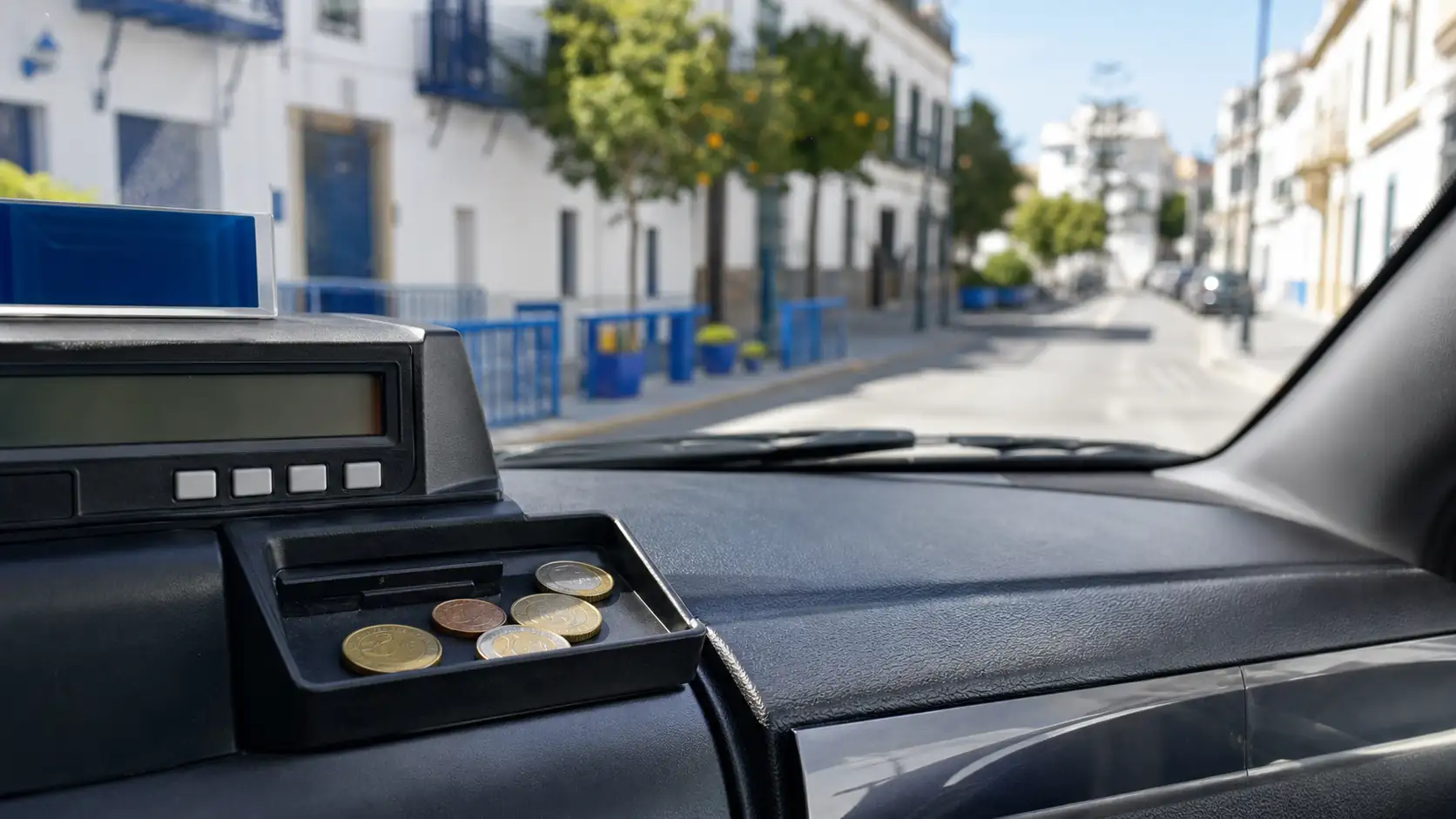 Taxi meter and coins showing rounding up for a Spain taxi tip Taxi meter and coins showing rounding up for a Spain taxi tip